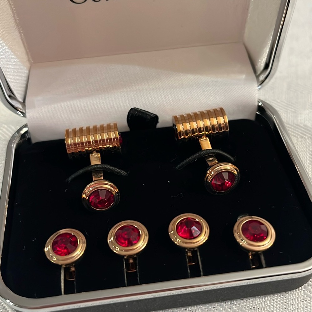Cuff Daddy Set of 6. Gold tone with Ruby Red stones. Never used.